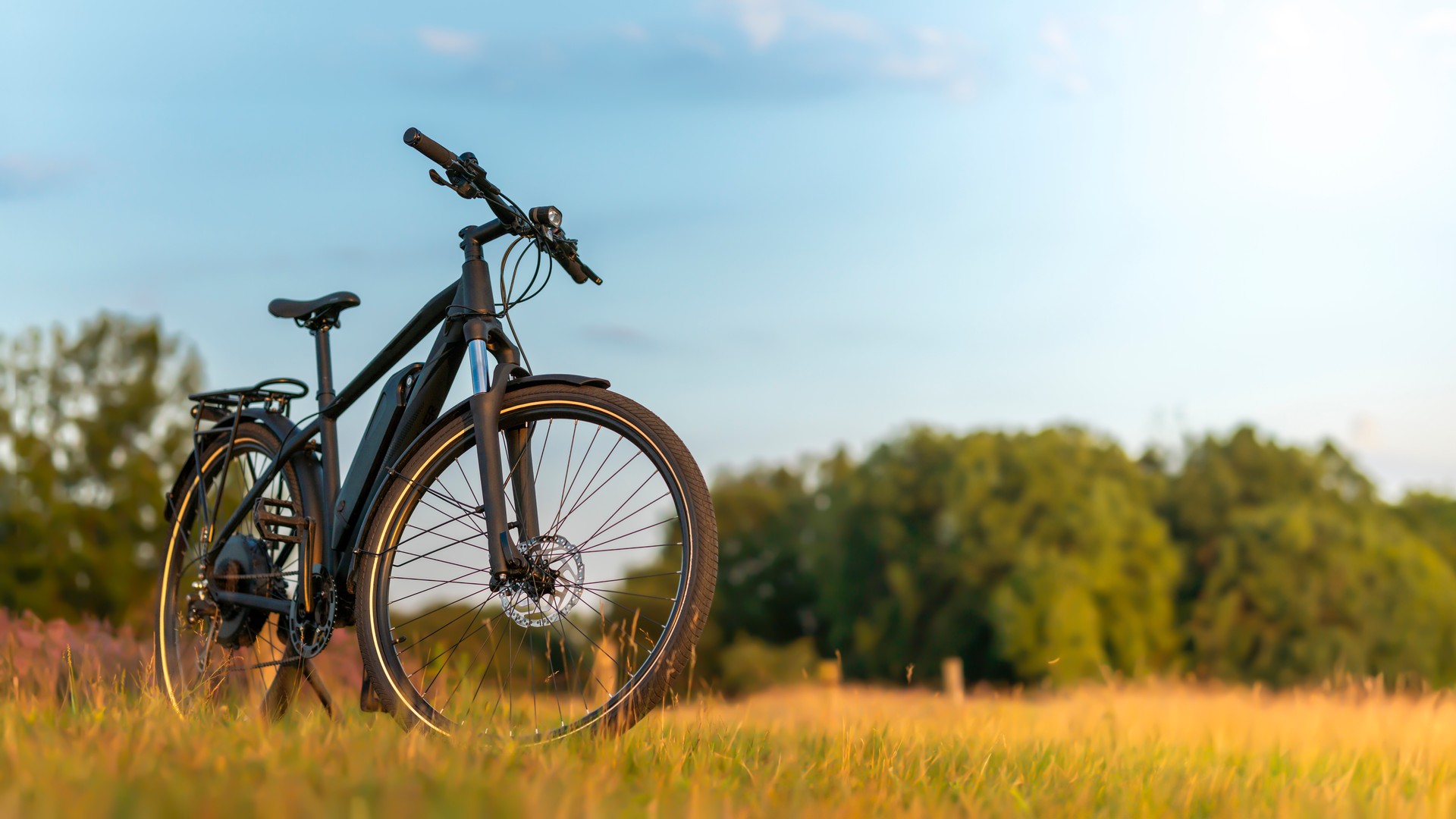 E-bike parked in a pristine landscape against the sunset